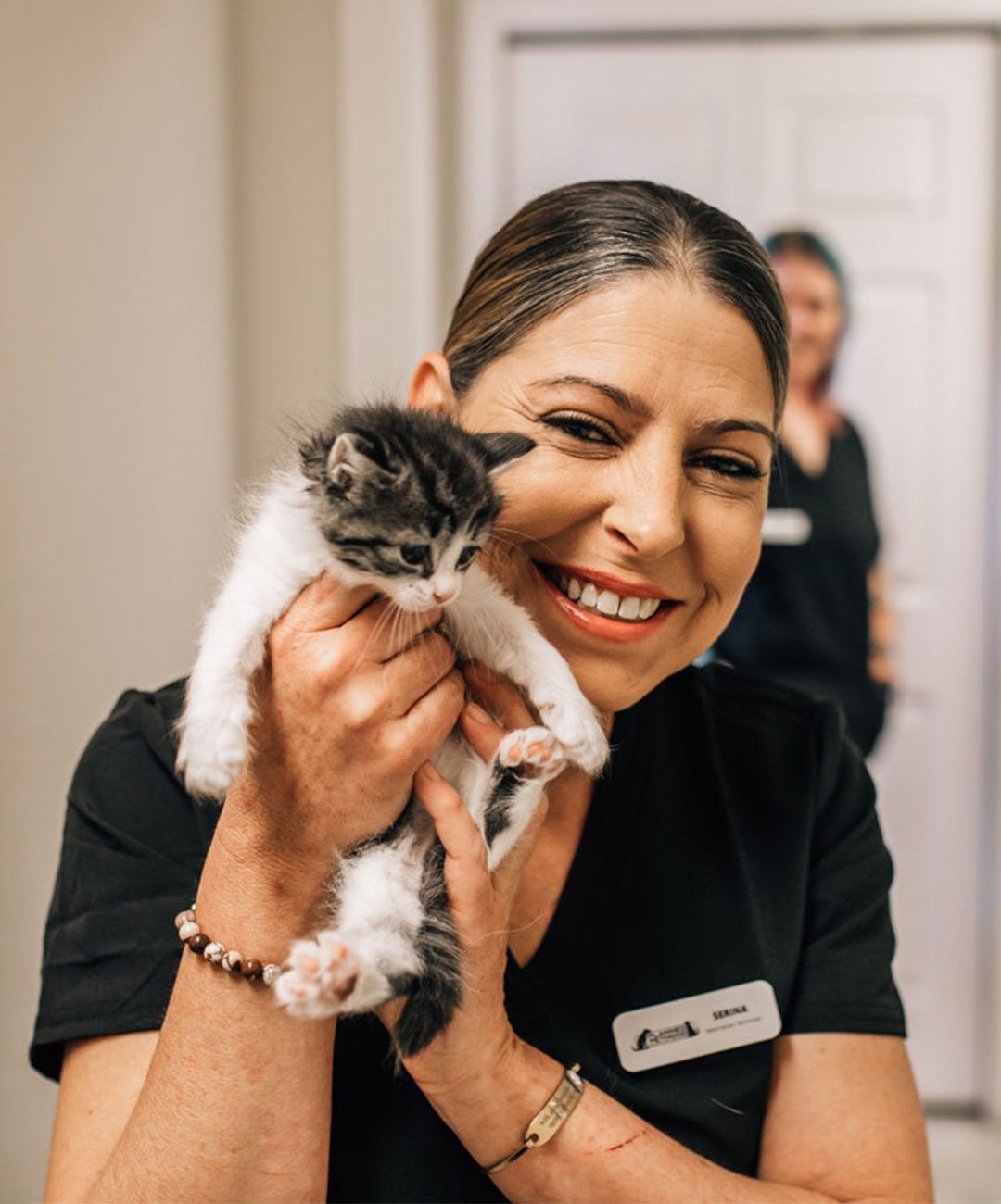 Happy Woman Holding Kitten