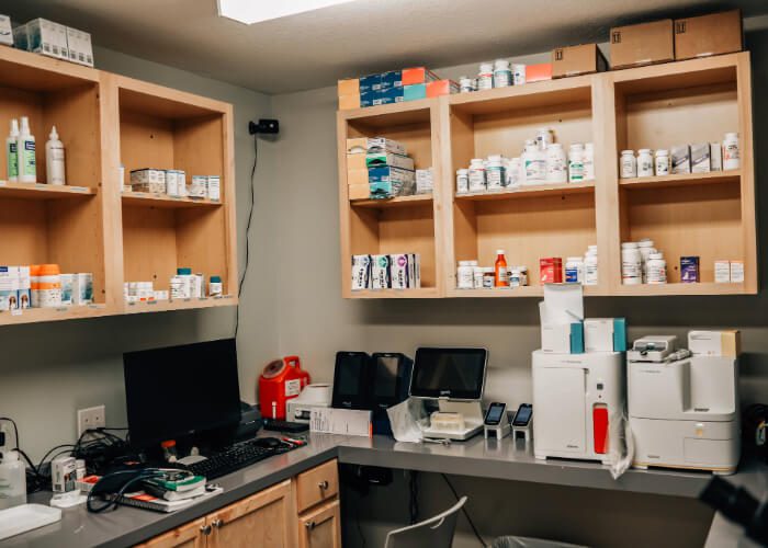 room with shelving filled with supplies for pets