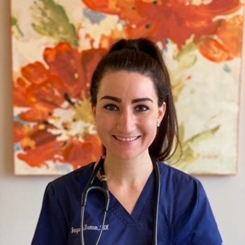 Dr. Brennan - female veterinarian with brown pony tail